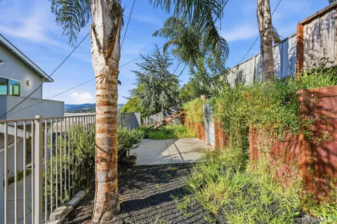 a view of a hallway with chandelier and entryway