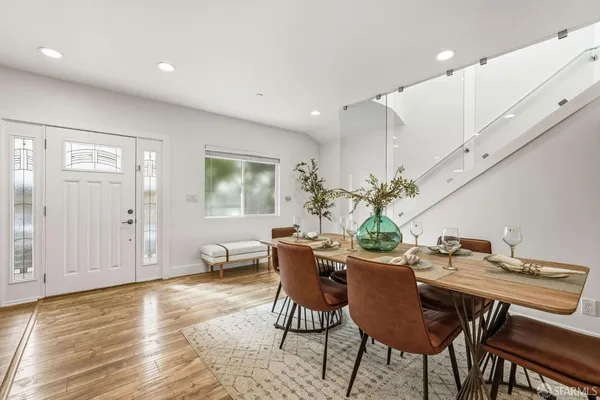 a dining room with furniture and window
