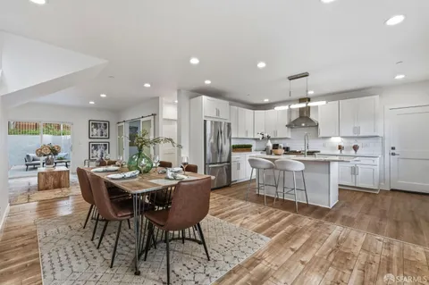 a kitchen with a table and chairs in it