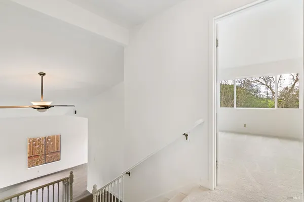 a view of a hallway with a window