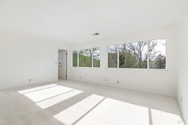 a view of an empty room with a window