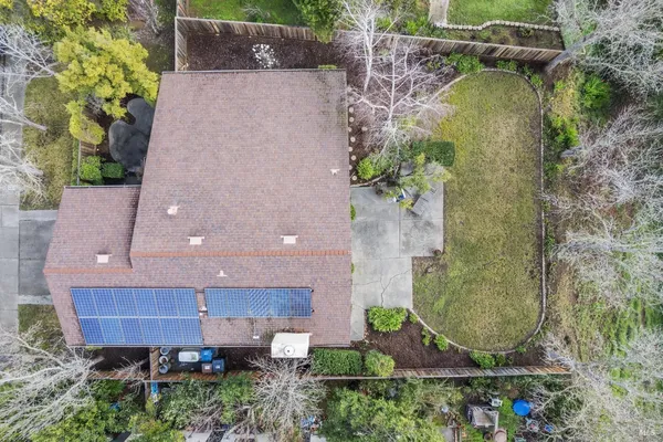an aerial view of residential houses with outdoor space