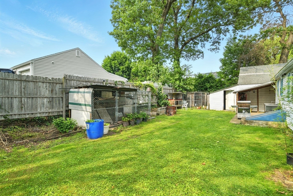 224 Cambria Street Springfield, MA 01118 - Photo 20 of 23 a front view of a house with a garden