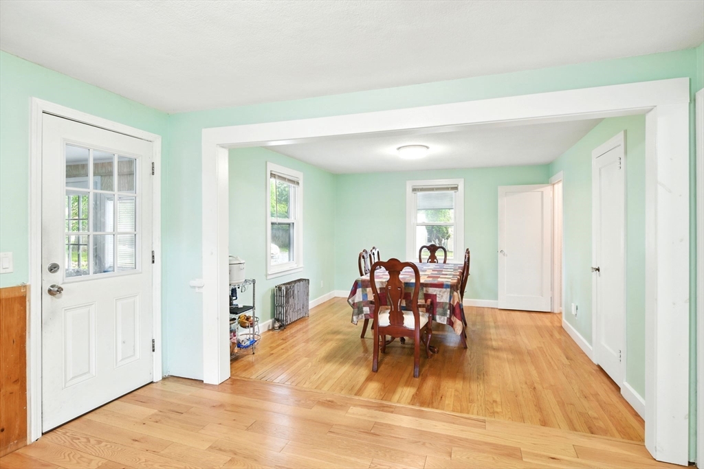224 Cambria Street Springfield, MA 01118 - Photo 4 of 23 a view of a dining room with furniture and wooden floor