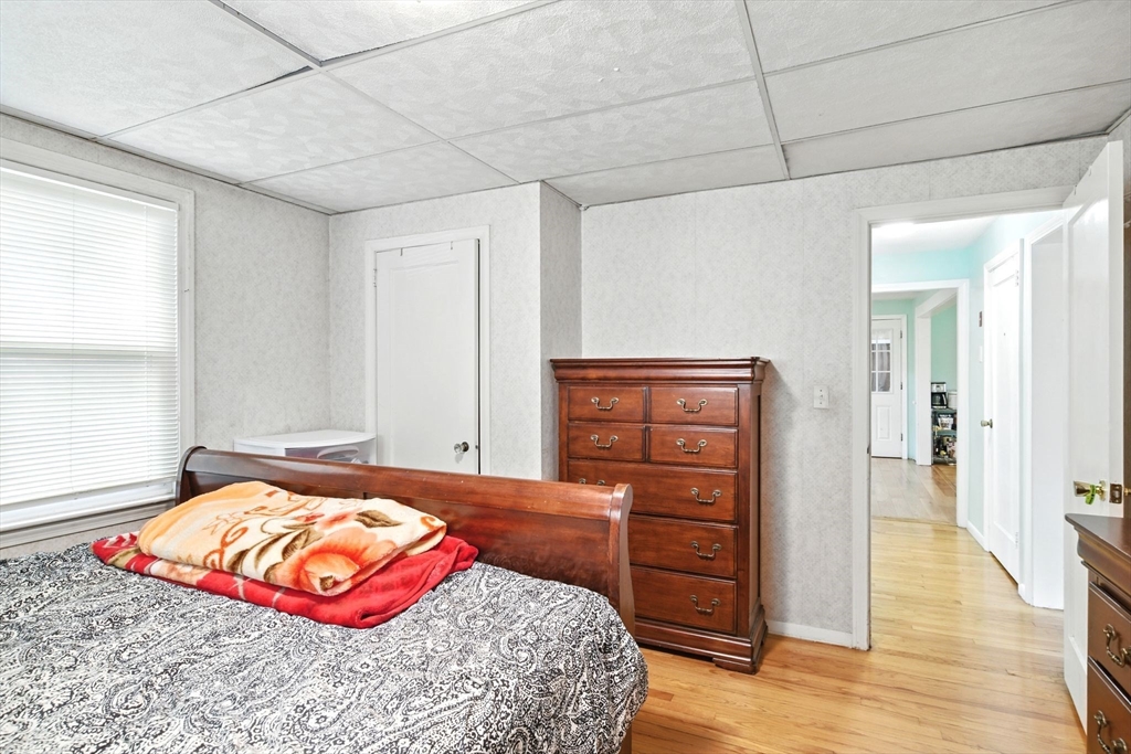 224 Cambria Street Springfield, MA 01118 - Photo 7 of 23 a bedroom with a bed and a dresser
