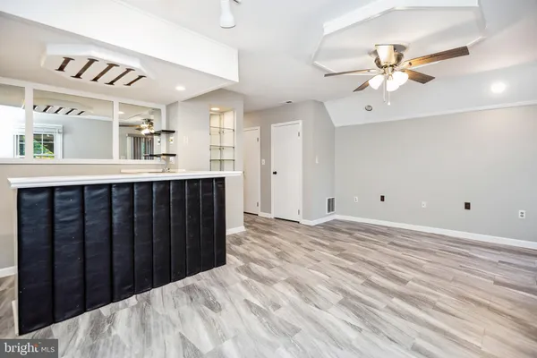 a view of a kitchen with a sink and cabinet area