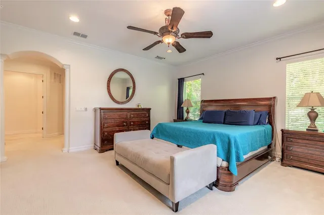 a bedroom with a bed and window