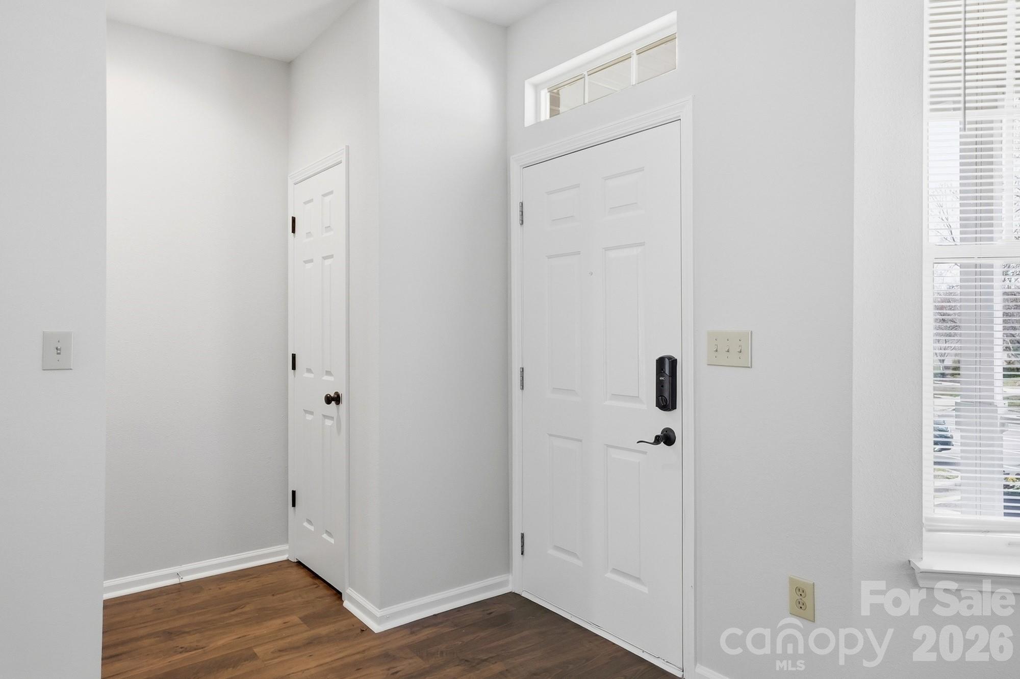 711 Stone Village Drive Fort Mill, SC 29708 - Photo 7 of 46 a view of a hallway with wooden floor and closet
