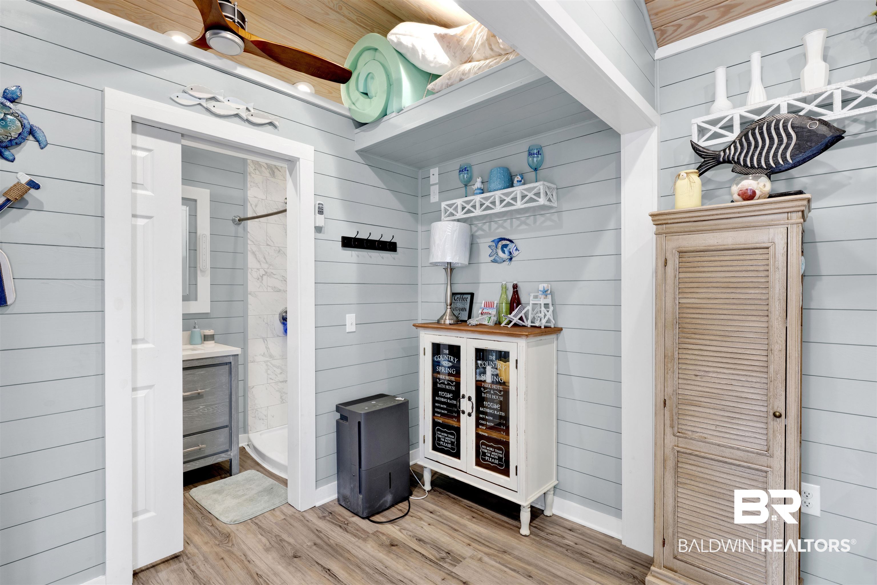 4650 Griffith Marina Road, Unit LOT 24 Orange Beach, AL 36561 - Photo 10 of 34 Bar with wooden walls and wood finished floors