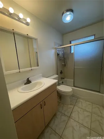 a bathroom with a toilet sink and shower