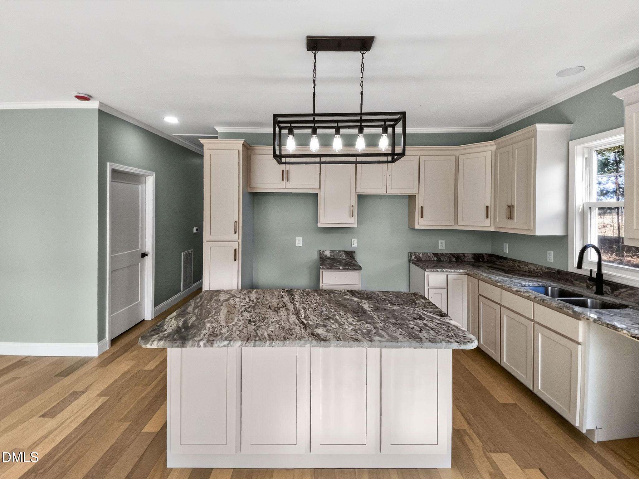 81 Pond View Court Rocky Mount, NC 27801 - Photo 17 of 28 a kitchen with kitchen island granite countertop stainless steel appliances a stove refrigerator and cabinets