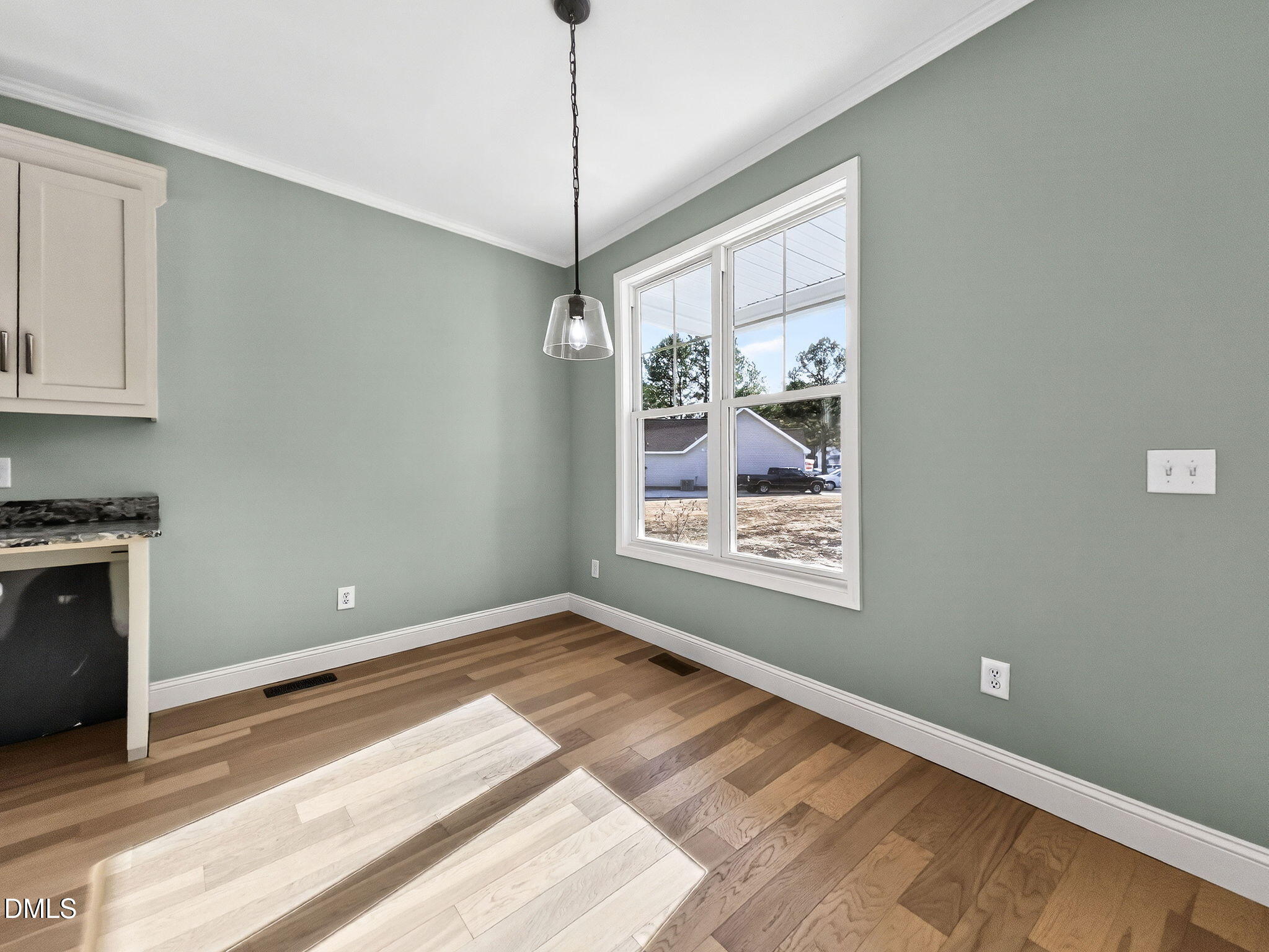 81 Pond View Court Rocky Mount, NC 27801 - Photo 19 of 28 a view of an empty room with a window and kitchen view