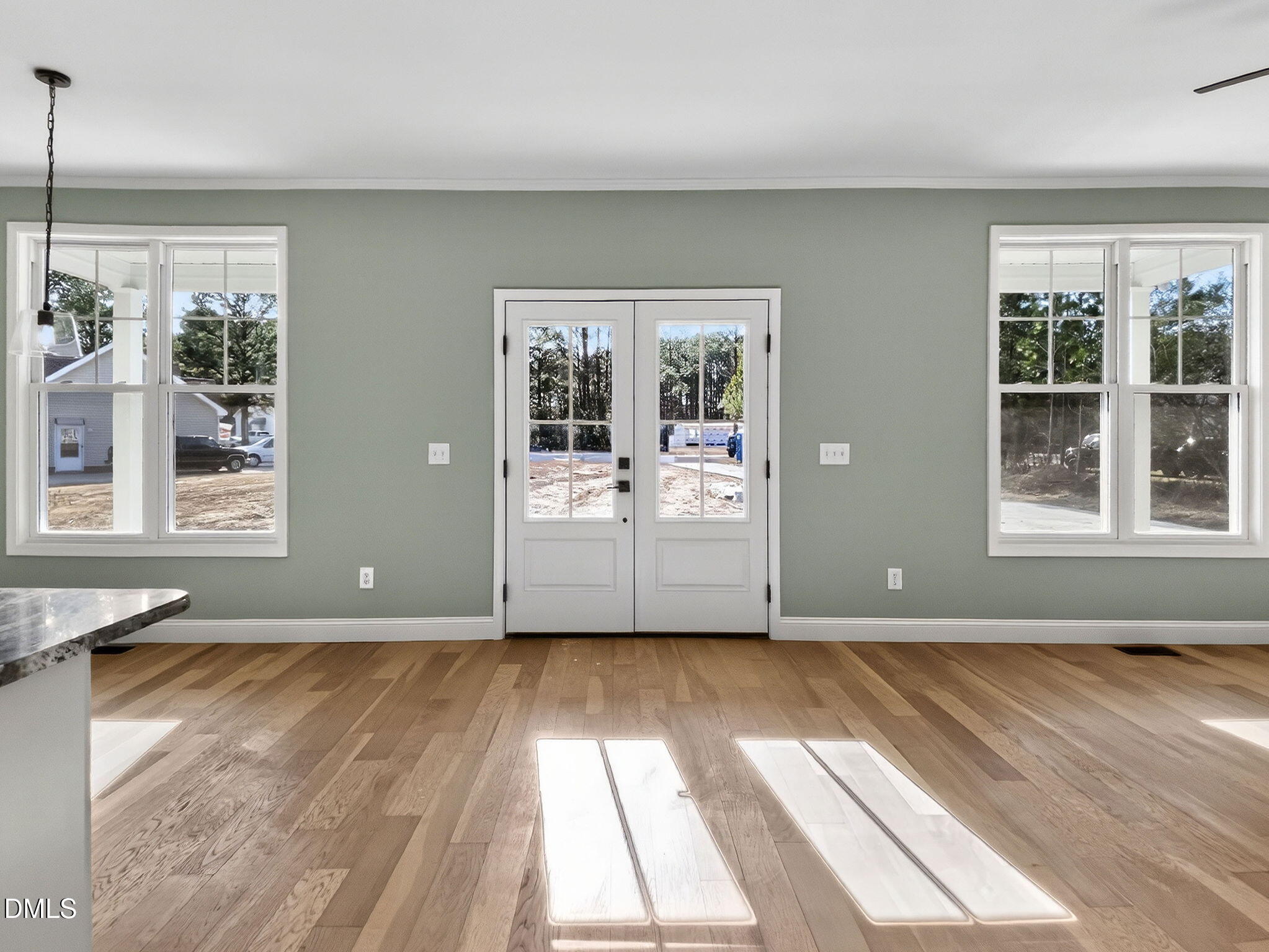 81 Pond View Court Rocky Mount, NC 27801 - Photo 21 of 28 a view of an empty room with a window and wooden floor