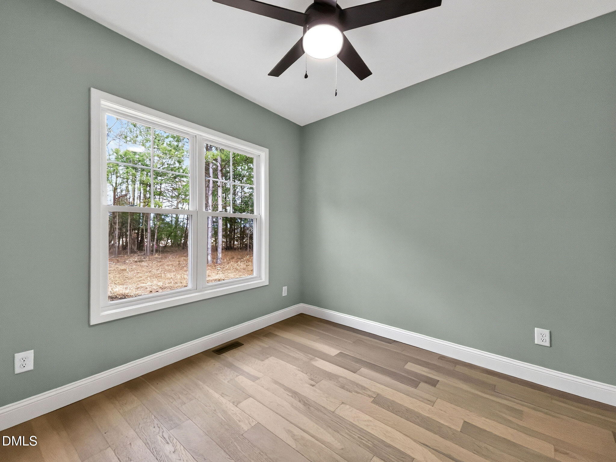81 Pond View Court Rocky Mount, NC 27801 - Photo 26 of 28 a view of an empty room with wooden floor and a window