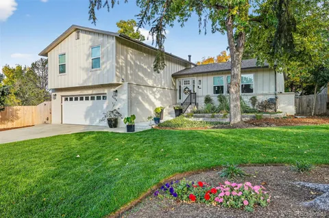 a front view of house with yard and outdoor seating