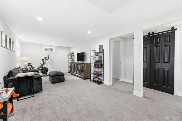 a view of a livingroom with walk in closet and a couch