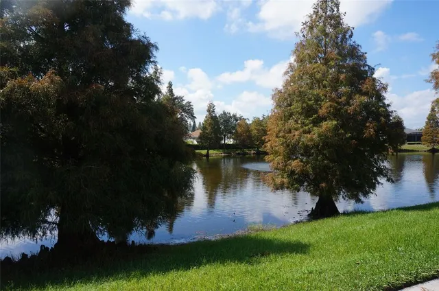 a view of a lake with a yard