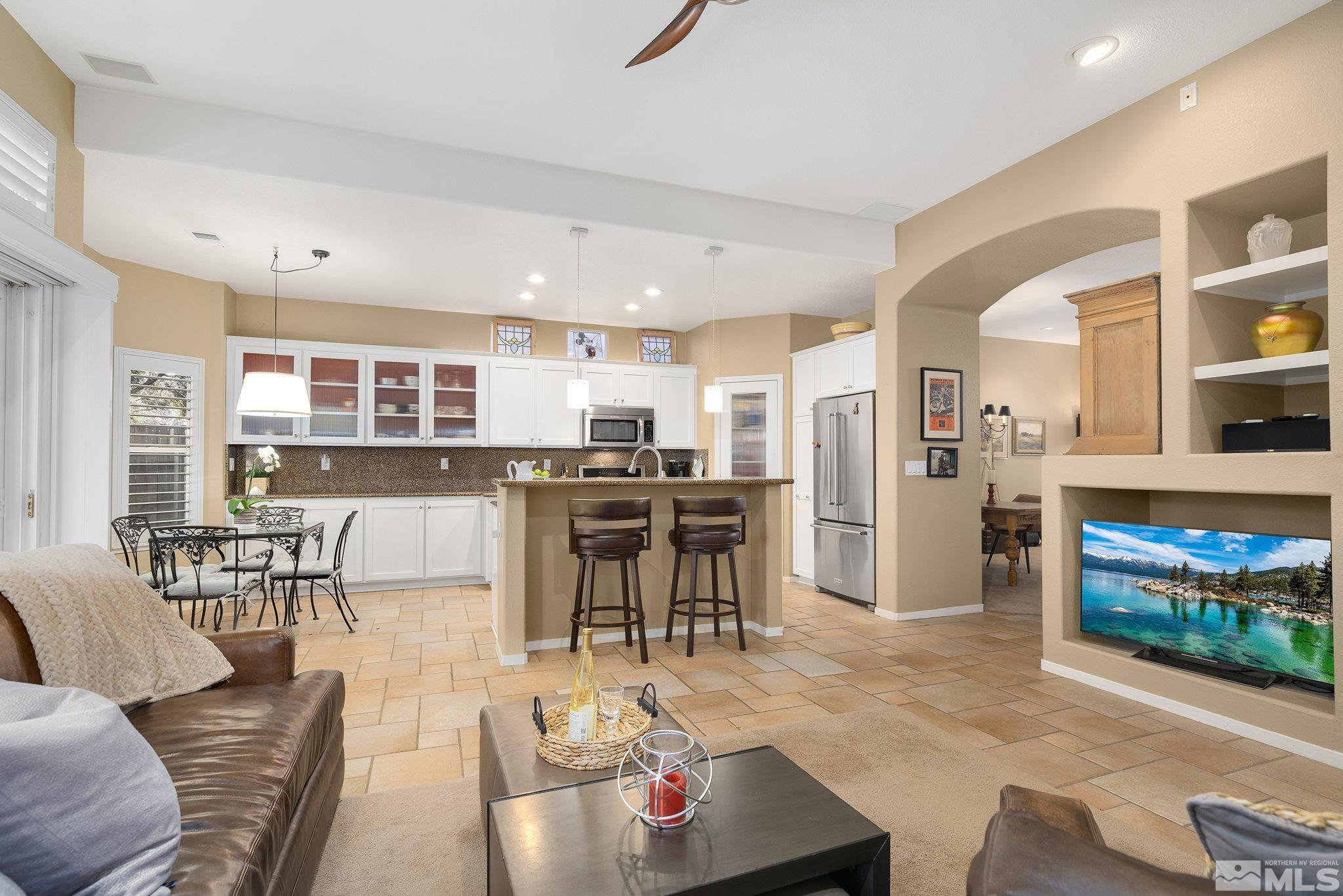 1700 Comanche Moon Drive Reno, NV 89521 - Photo 14 of 34 a living room with lots of furniture and kitchen view