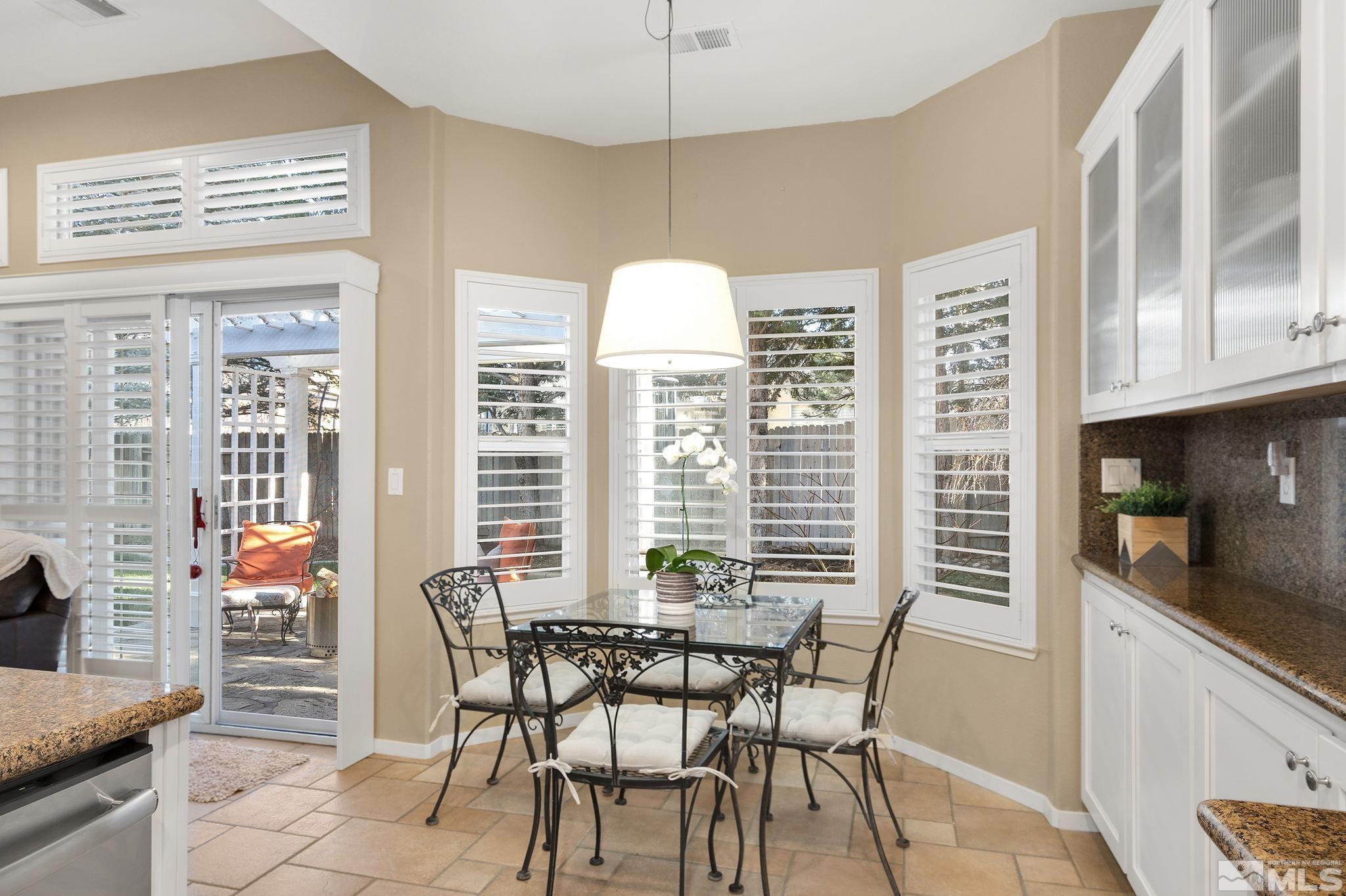 1700 Comanche Moon Drive Reno, NV 89521 - Photo 18 of 34 a dining room with furniture and window