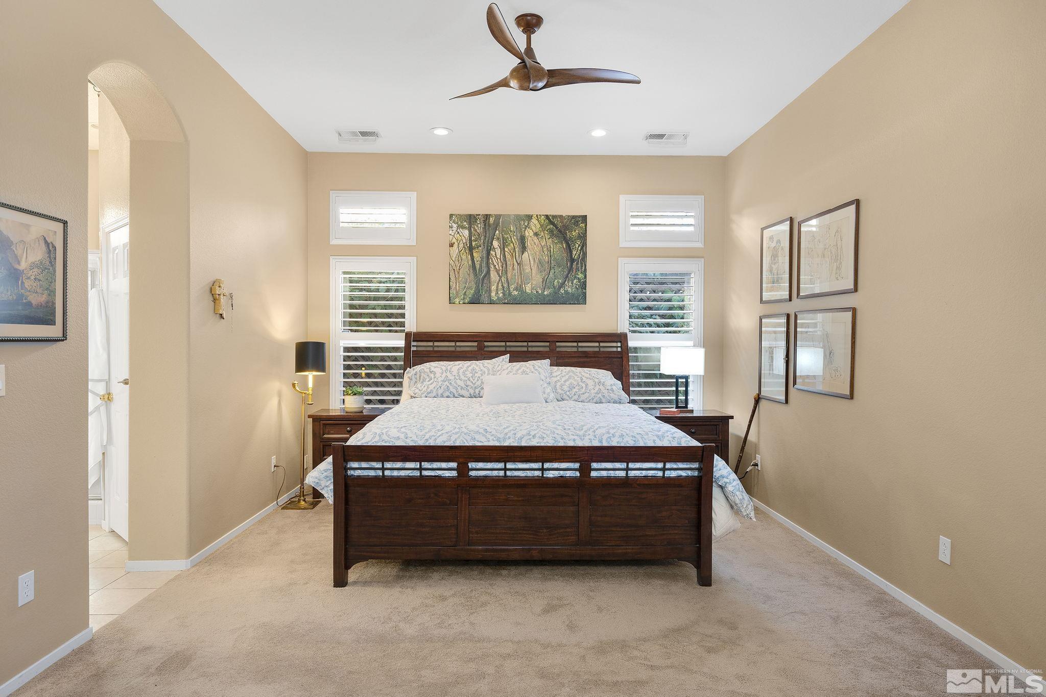 1700 Comanche Moon Drive Reno, NV 89521 - Photo 19 of 34 a spacious bedroom with a bed and window