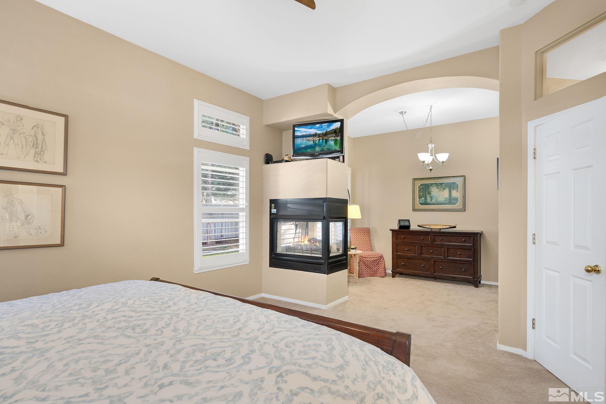 1700 Comanche Moon Drive Reno, NV 89521 - Photo 20 of 34 a bed room with a bed and a television