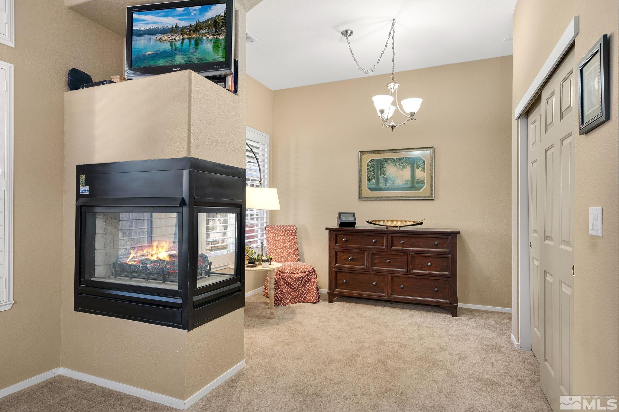 1700 Comanche Moon Drive Reno, NV 89521 - Photo 21 of 34 a living room with furniture and a fireplace