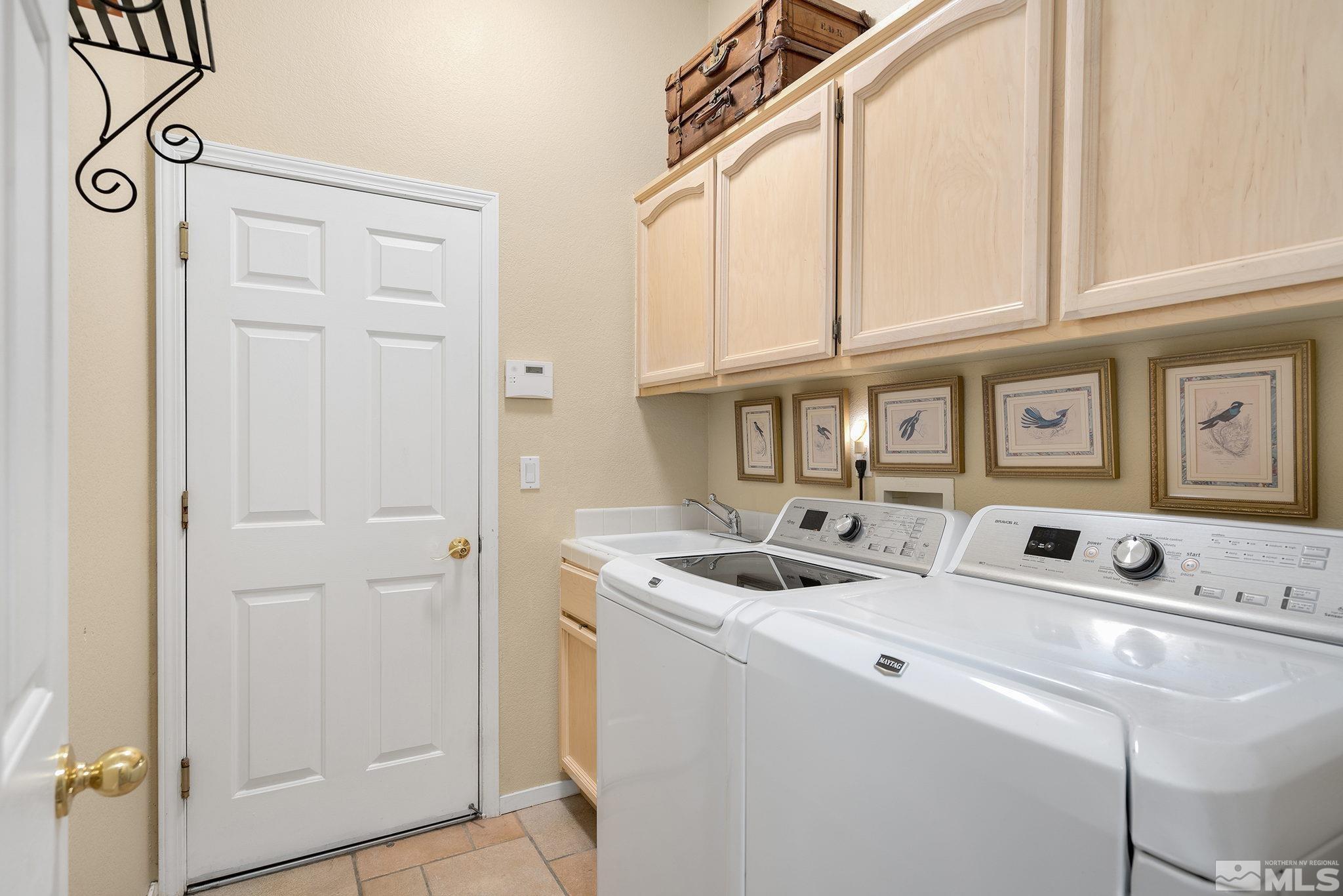 1700 Comanche Moon Drive Reno, NV 89521 - Photo 25 of 34 a utility room with dryer and washer