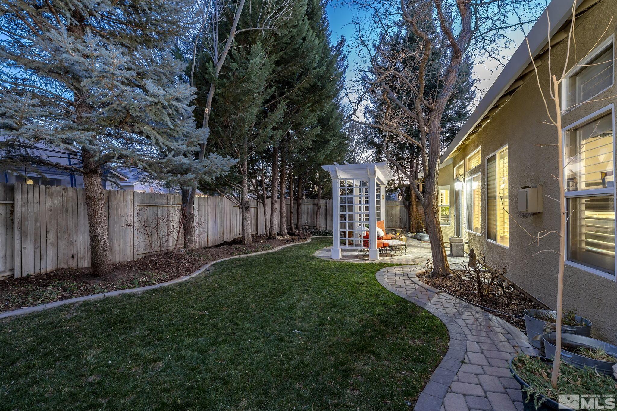 1700 Comanche Moon Drive Reno, NV 89521 - Photo 31 of 34 a view of a back yard of the house with green space and wooden fence
