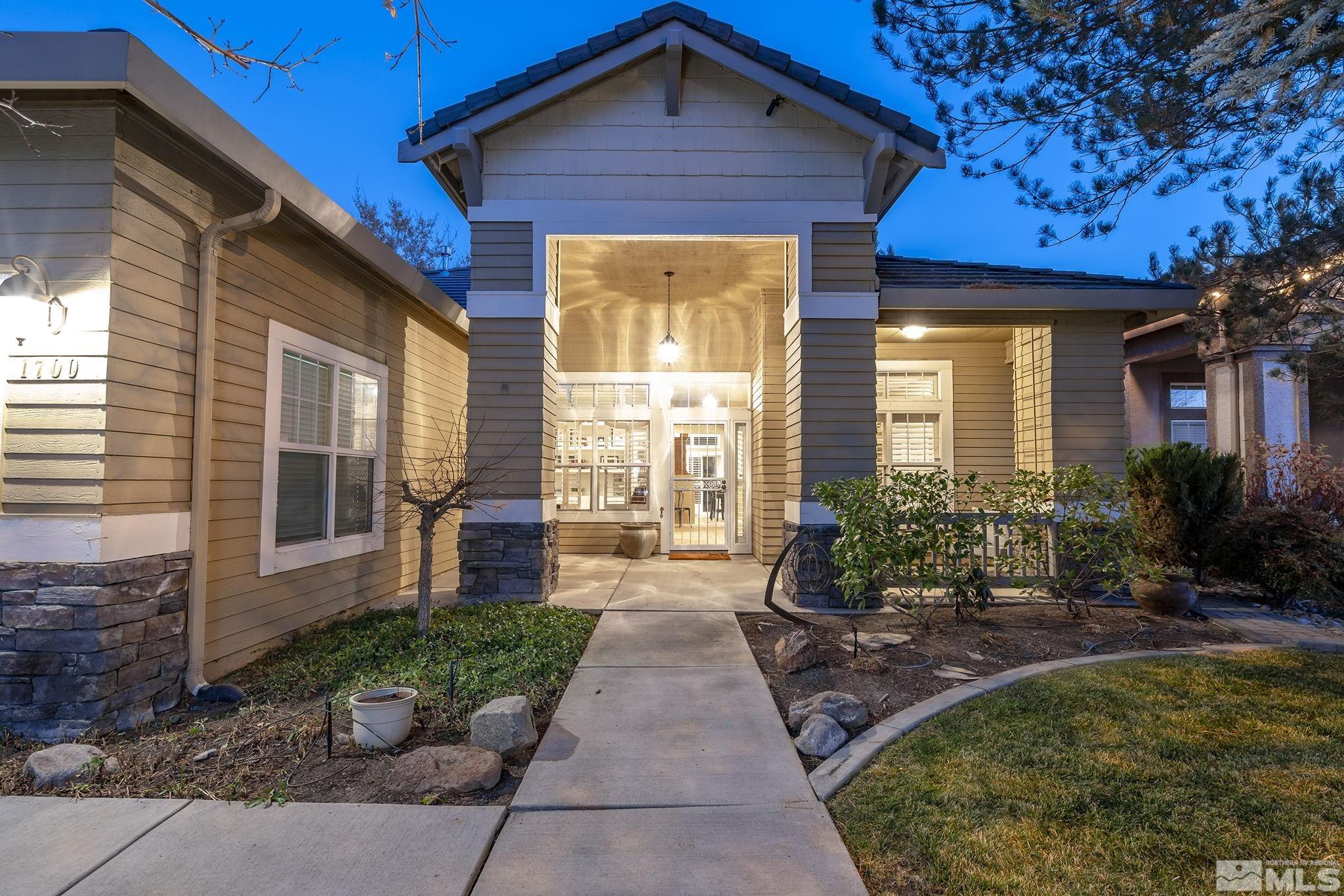 1700 Comanche Moon Drive Reno, NV 89521 - Photo 4 of 34 a front view of a house with garden