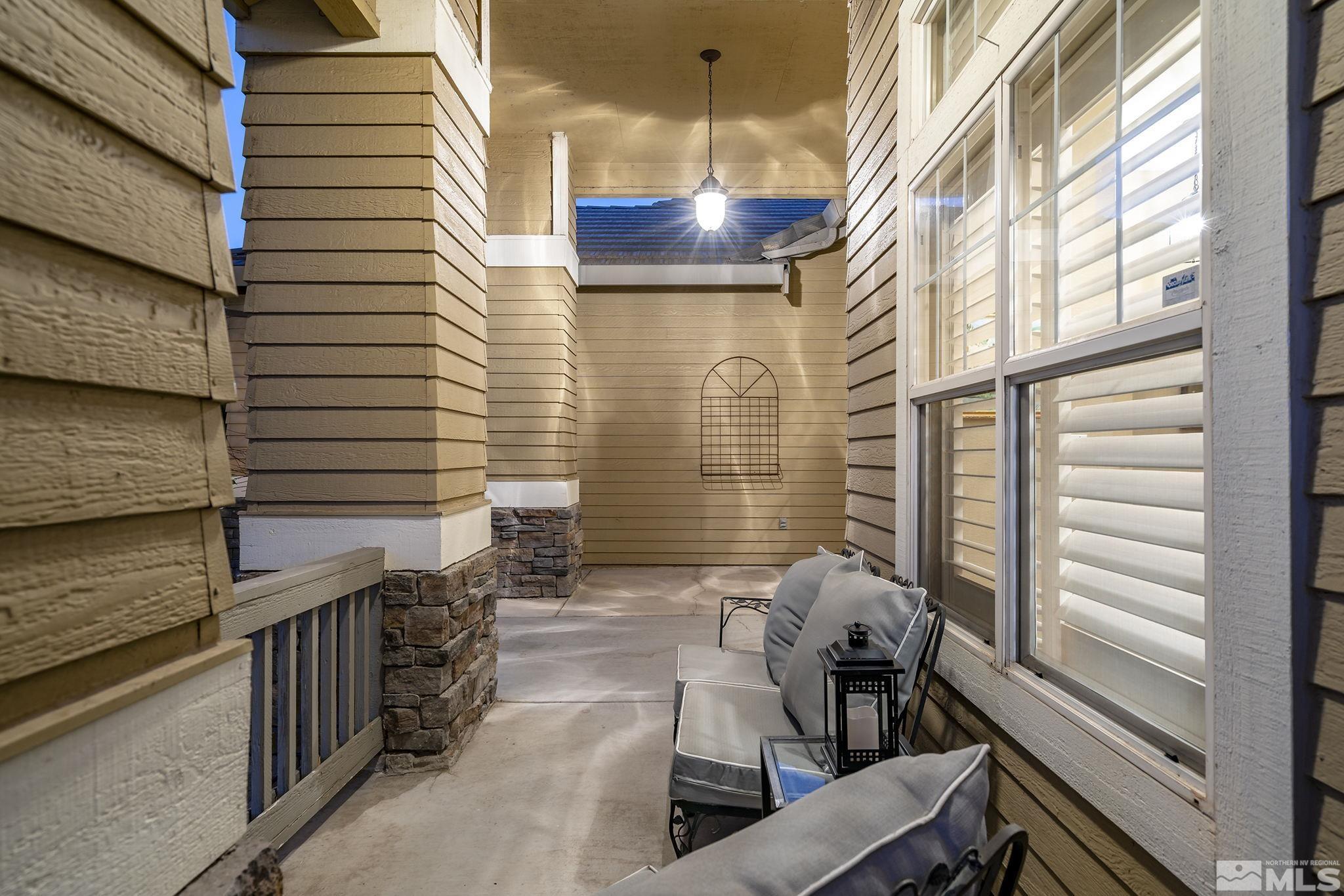 1700 Comanche Moon Drive Reno, NV 89521 - Photo 5 of 34 a view of a patio with a table and chairs and wooden floor