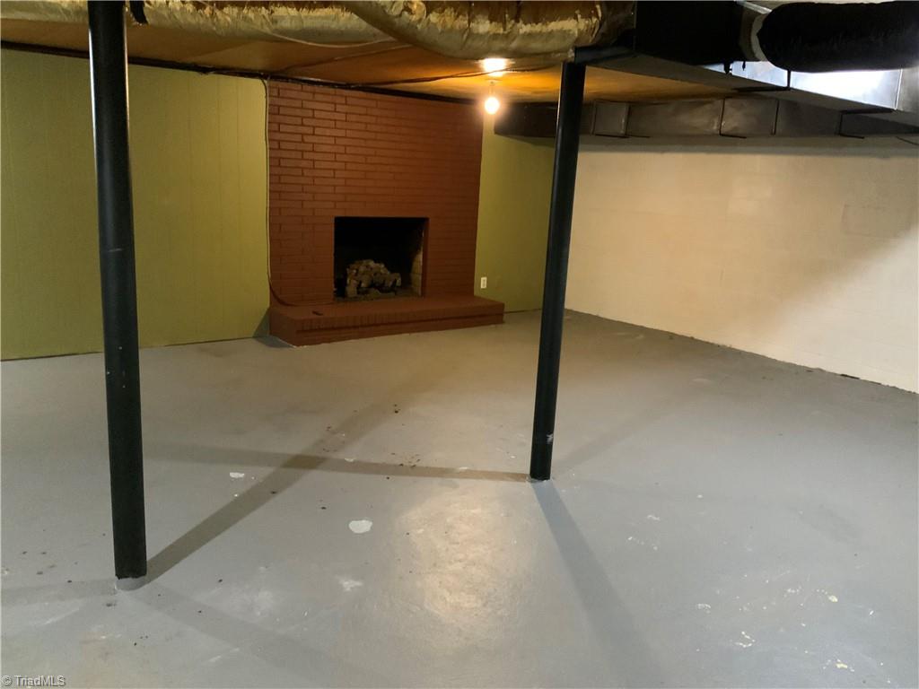 1805 Bringle Ferry Road, Unit 1805 Salisbury, NC 28146 - Photo 23 of 25 Basement w/ fireplace.