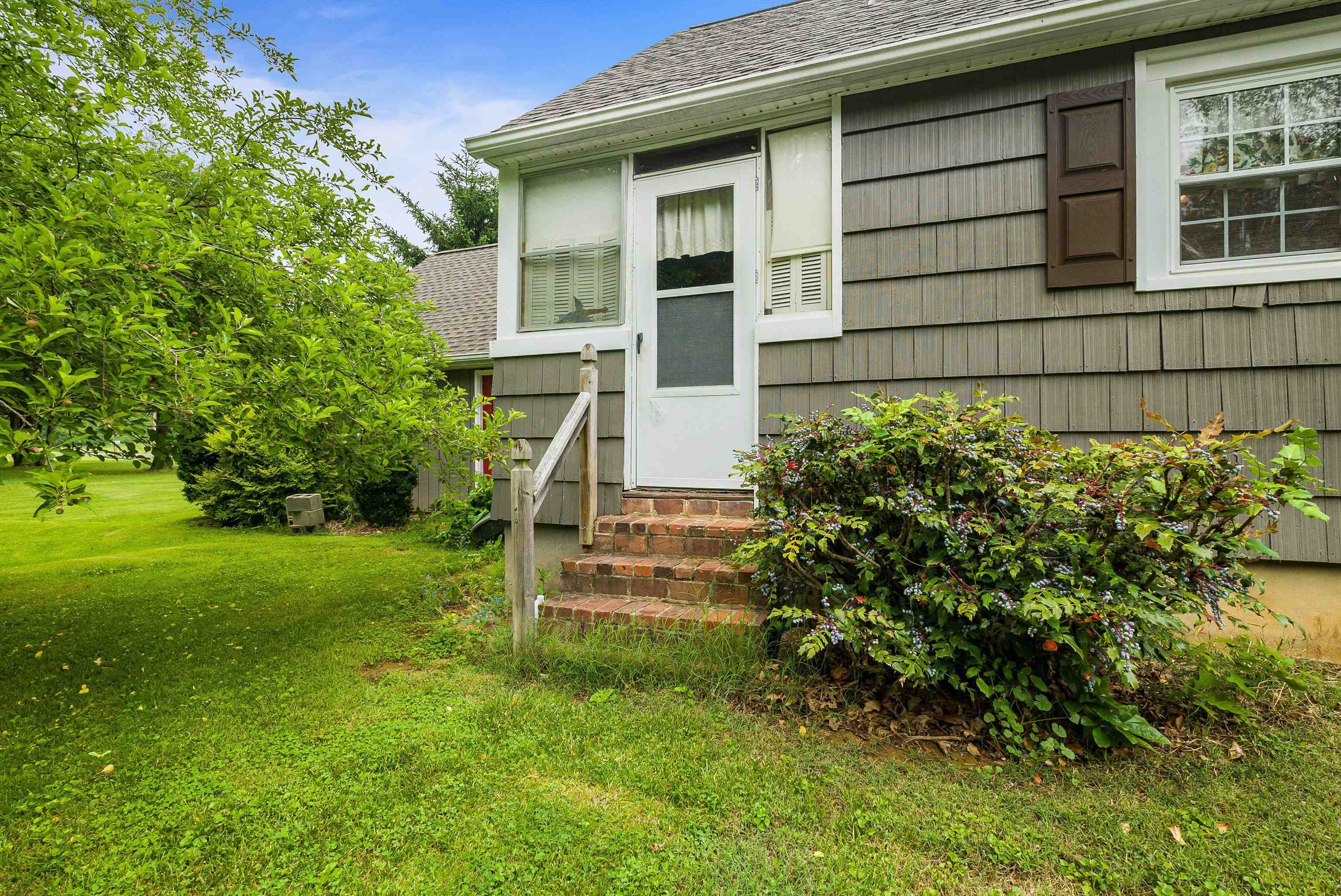 2156 Lyndhurst Road Waynesboro, VA 22980 - Photo 21 of 35 a front view of a house with a yard
