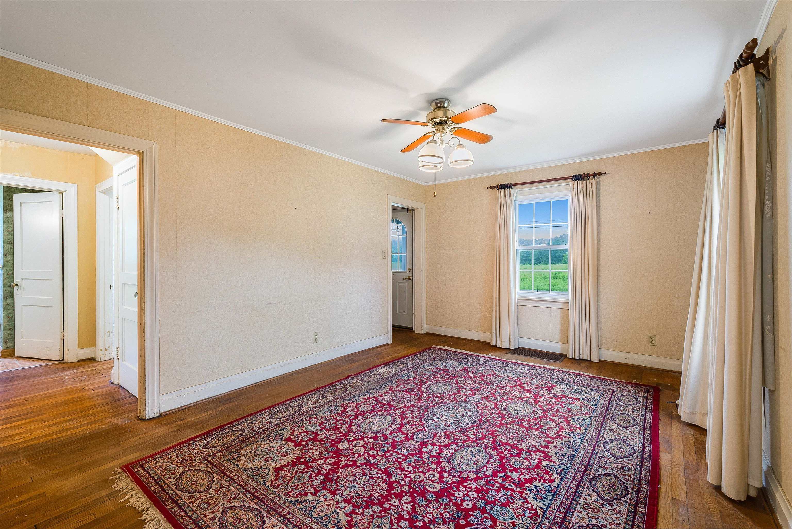 2156 Lyndhurst Road Waynesboro, VA 22980 - Photo 7 of 35 an empty room with windows and wooden floor