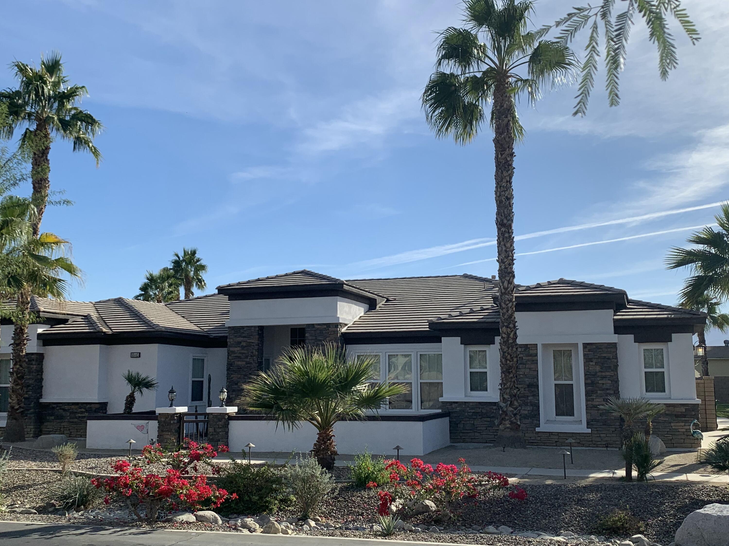 80445 Paria Way Indio, CA 92201 - Photo 2 of 70 a front view of a house with garden