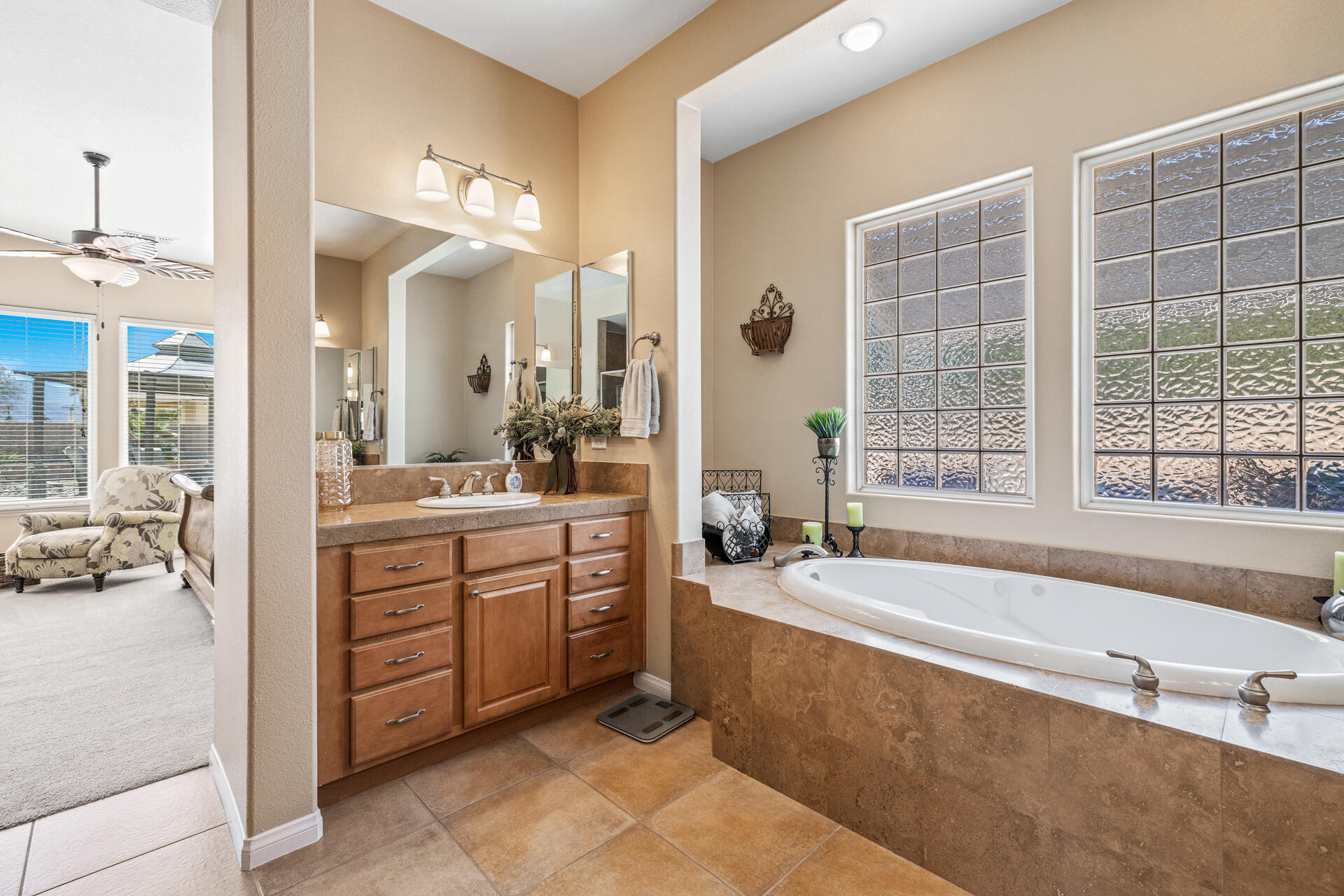 80445 Paria Way Indio, CA 92201 - Photo 26 of 70 a spacious bathroom with a tub sink and mirror