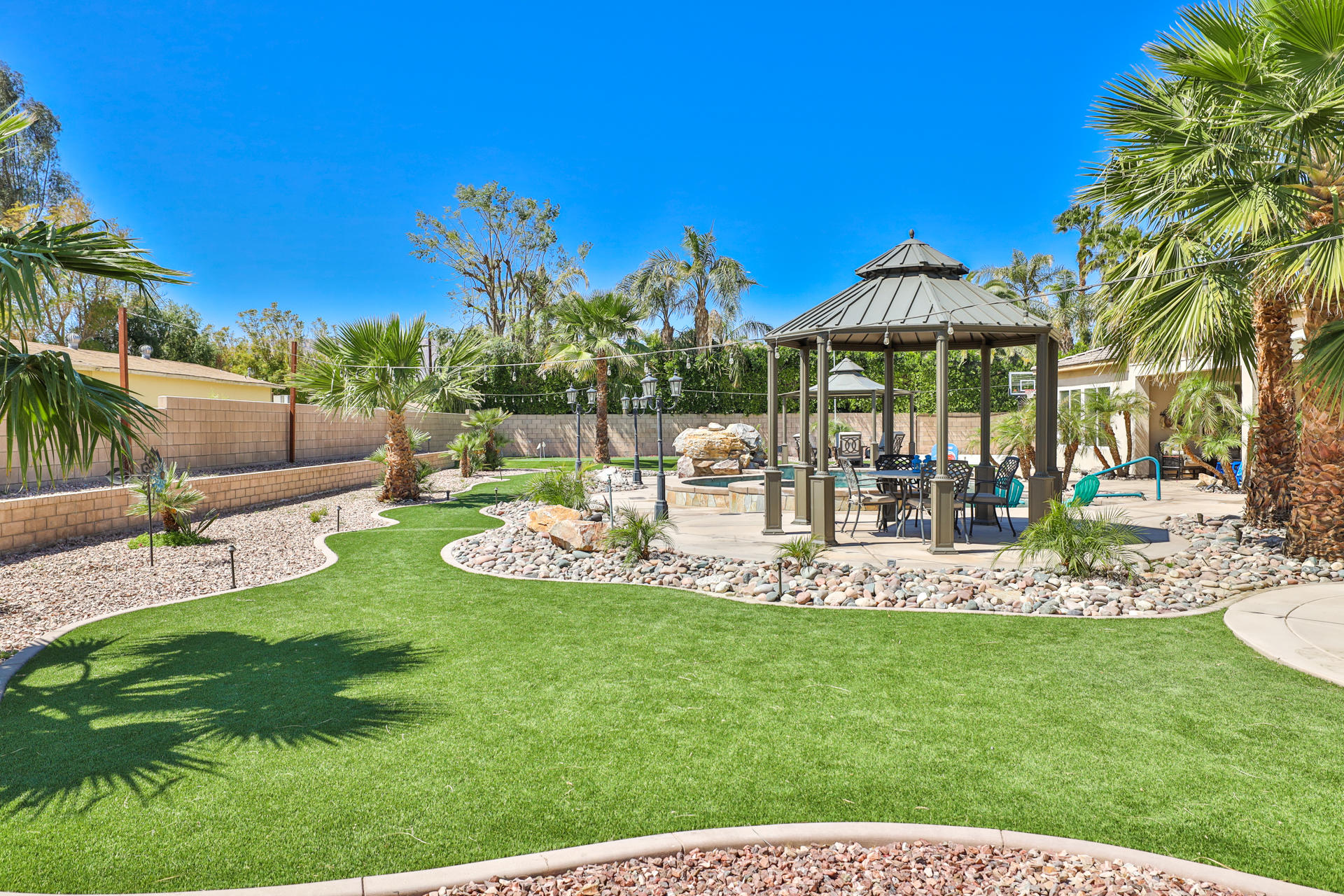 80445 Paria Way Indio, CA 92201 - Photo 39 of 70 a view of a chair and table of the garden