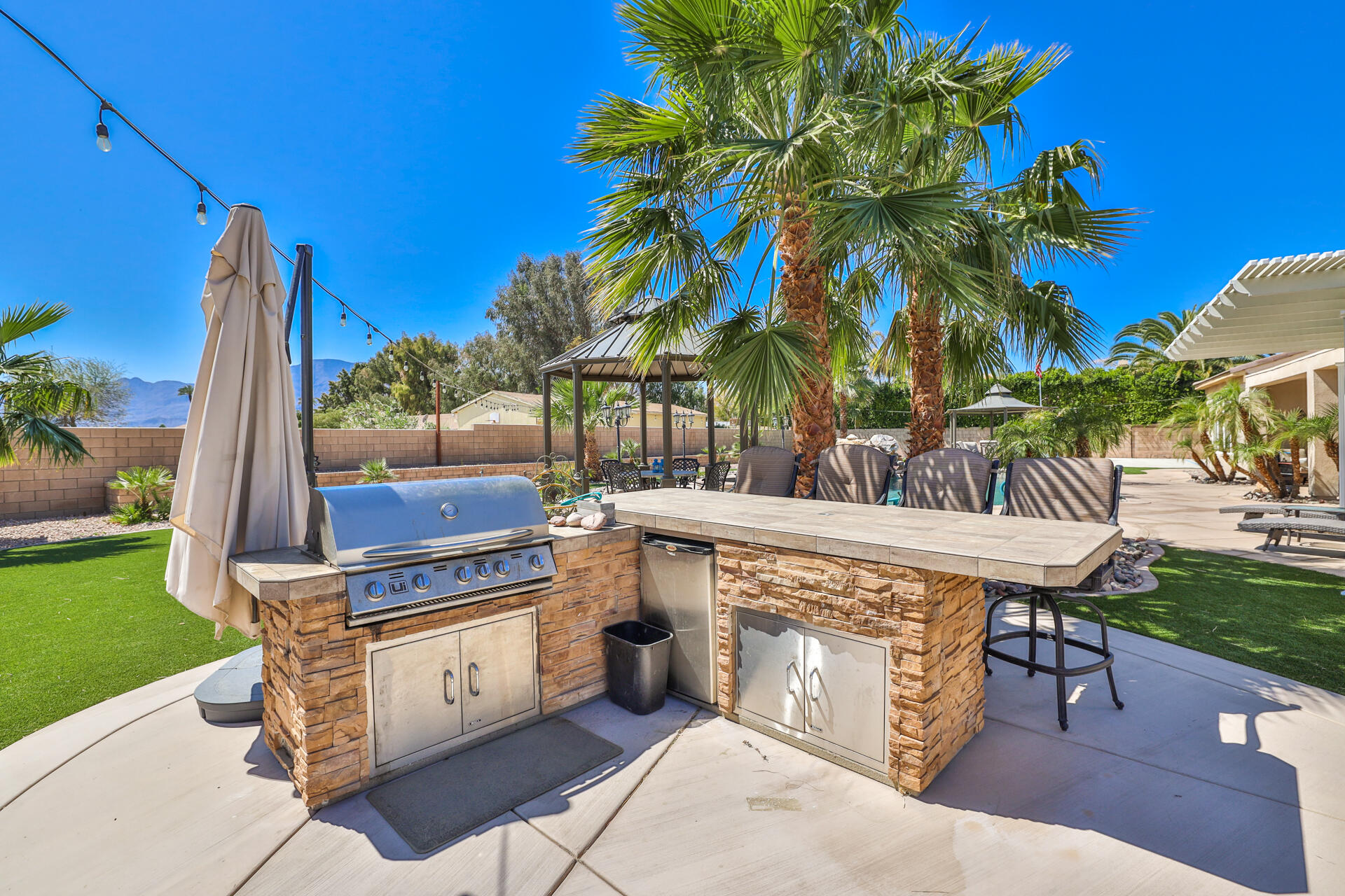 80445 Paria Way Indio, CA 92201 - Photo 41 of 70 a view of a chairs and table in the patio