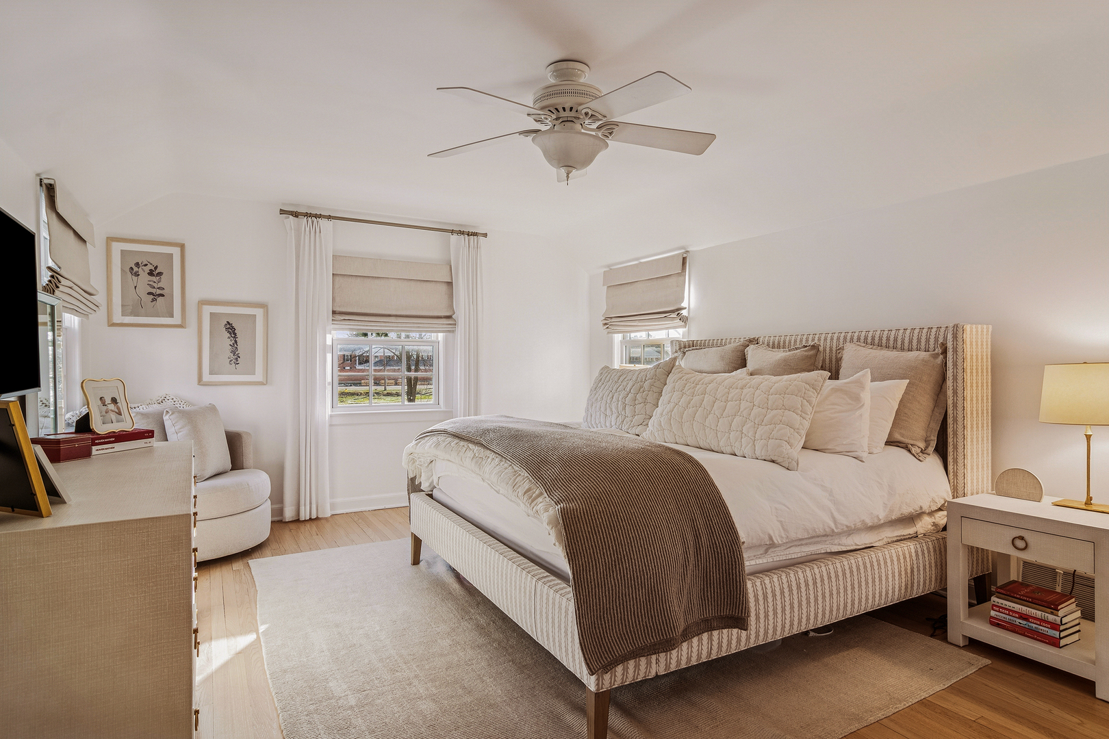 240 Elm Road Barrington, IL 60010 - Photo 31 of 56 a spacious bedroom with a bed and a couch