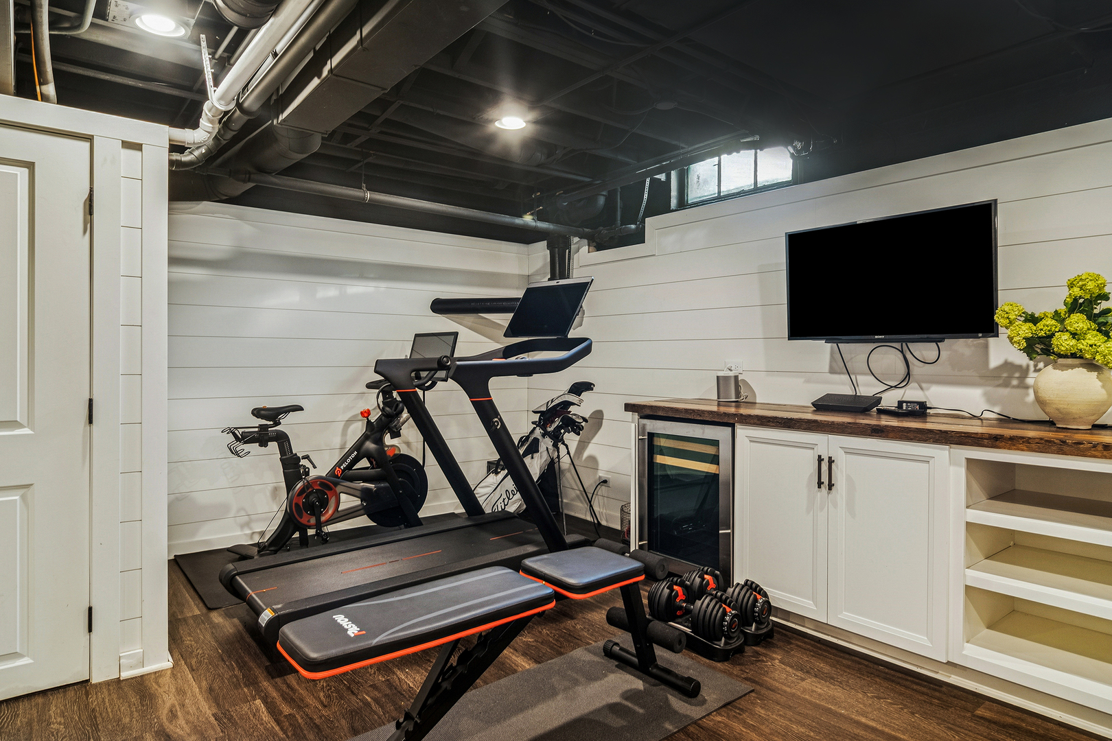 240 Elm Road Barrington, IL 60010 - Photo 43 of 56 a room with gym equipment and a flat screen tv