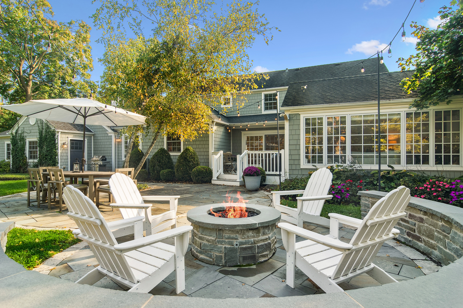 240 Elm Road Barrington, IL 60010 - Photo 47 of 56 a view of a patio with couches table and chairs and potted plants