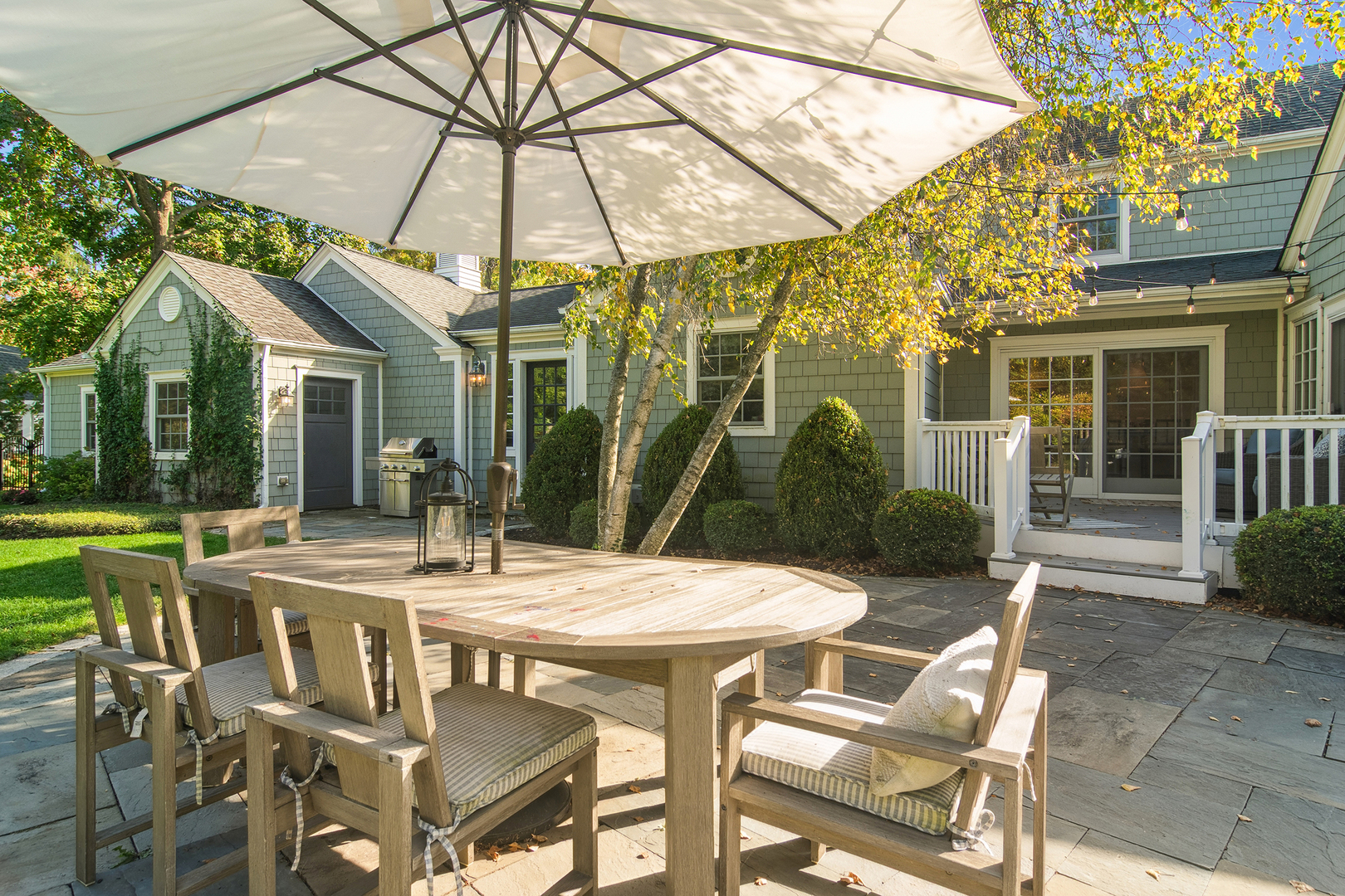 240 Elm Road Barrington, IL 60010 - Photo 49 of 56 a view of a patio with a table and chairs under an umbrella