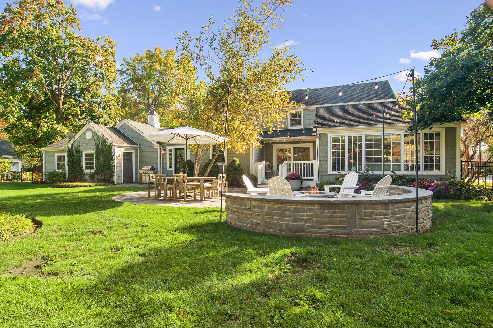240 Elm Road Barrington, IL 60010 - Photo 50 of 56 a view of a house with swimming pool and sitting area