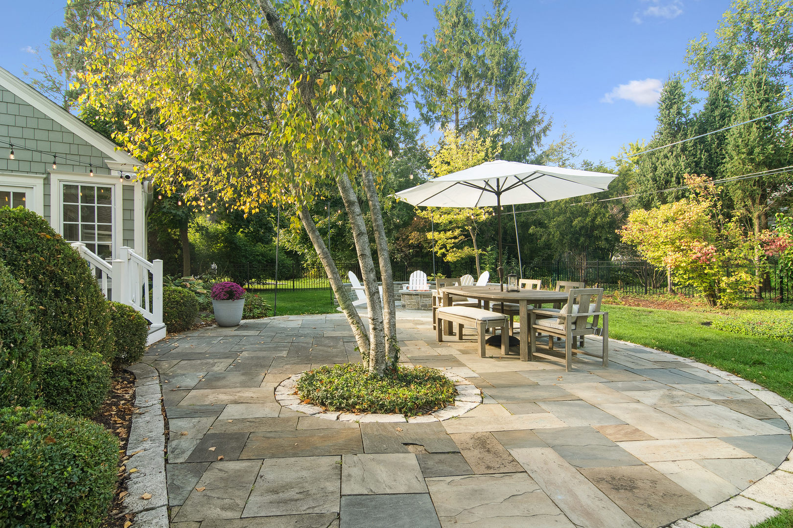 240 Elm Road Barrington, IL 60010 - Photo 52 of 56 a view of a patio with a table and chairs under an umbrella