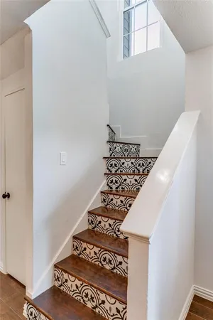 a view of room with window ceiling fan and hardwood floor
