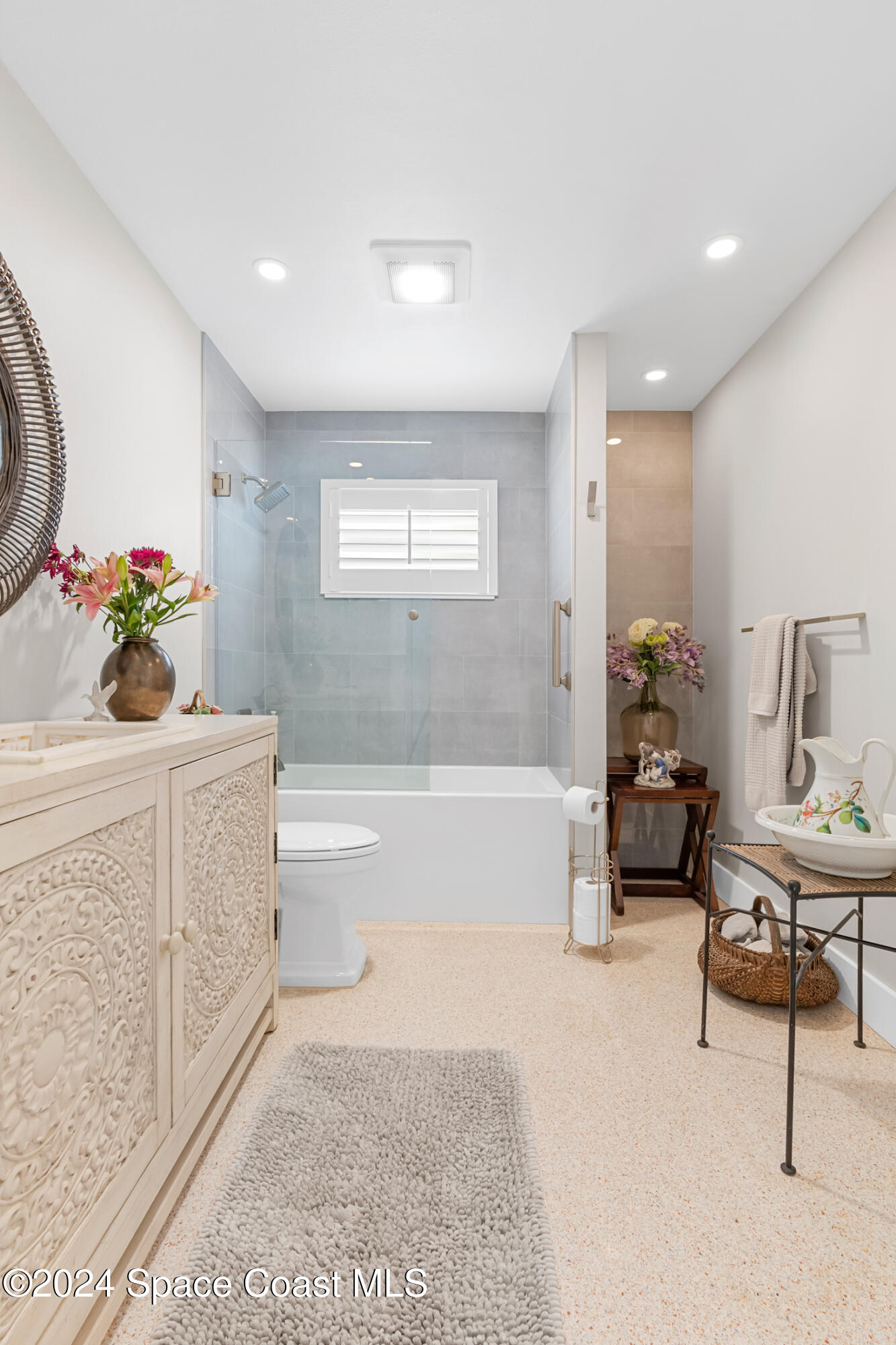 2051 Bali Road Cocoa Beach, FL 32931 - Photo 15 of 33 a bathroom with a sink a vanity and bathtub