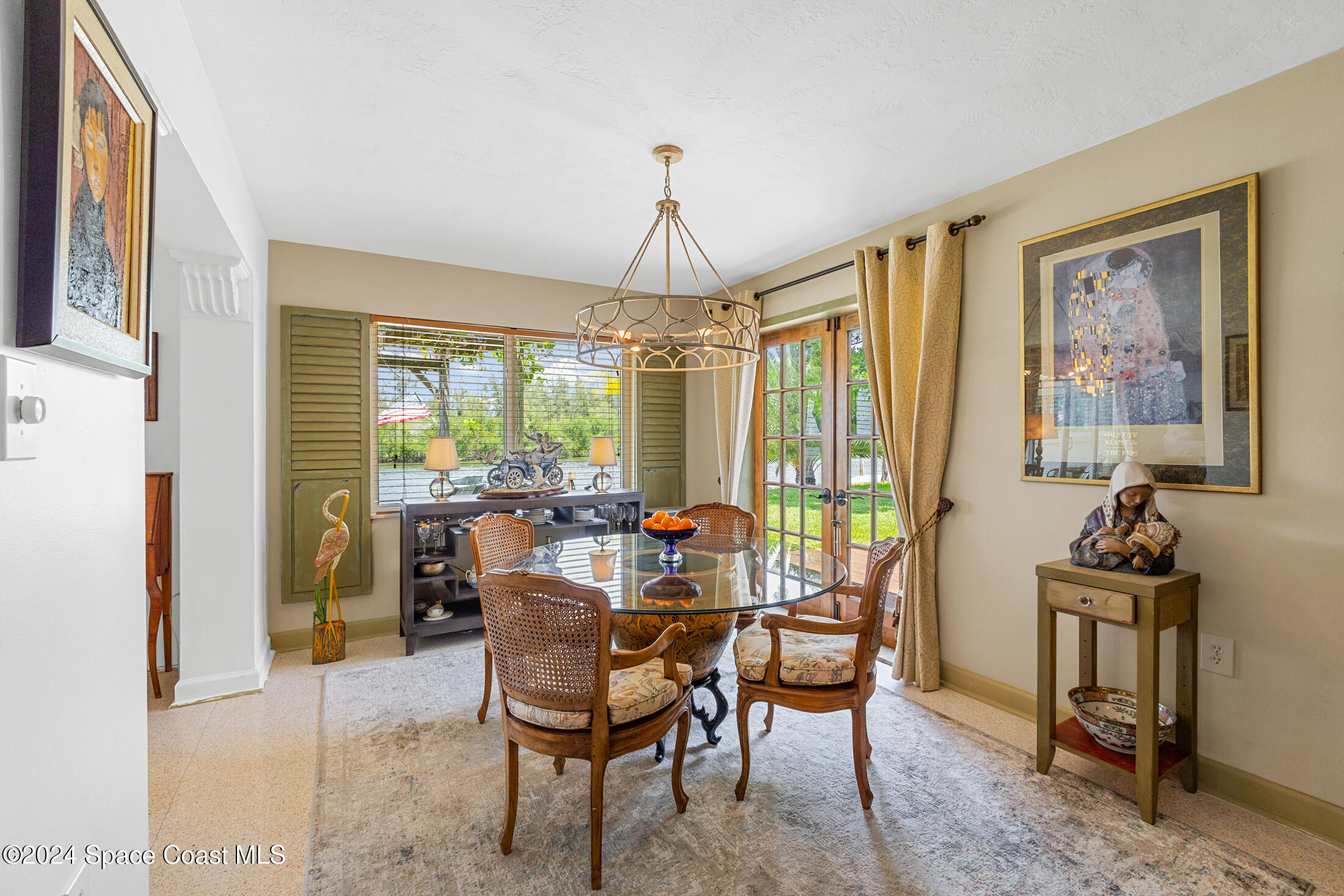 2051 Bali Road Cocoa Beach, FL 32931 - Photo 16 of 33 a view of a dining room with furniture window and outside view