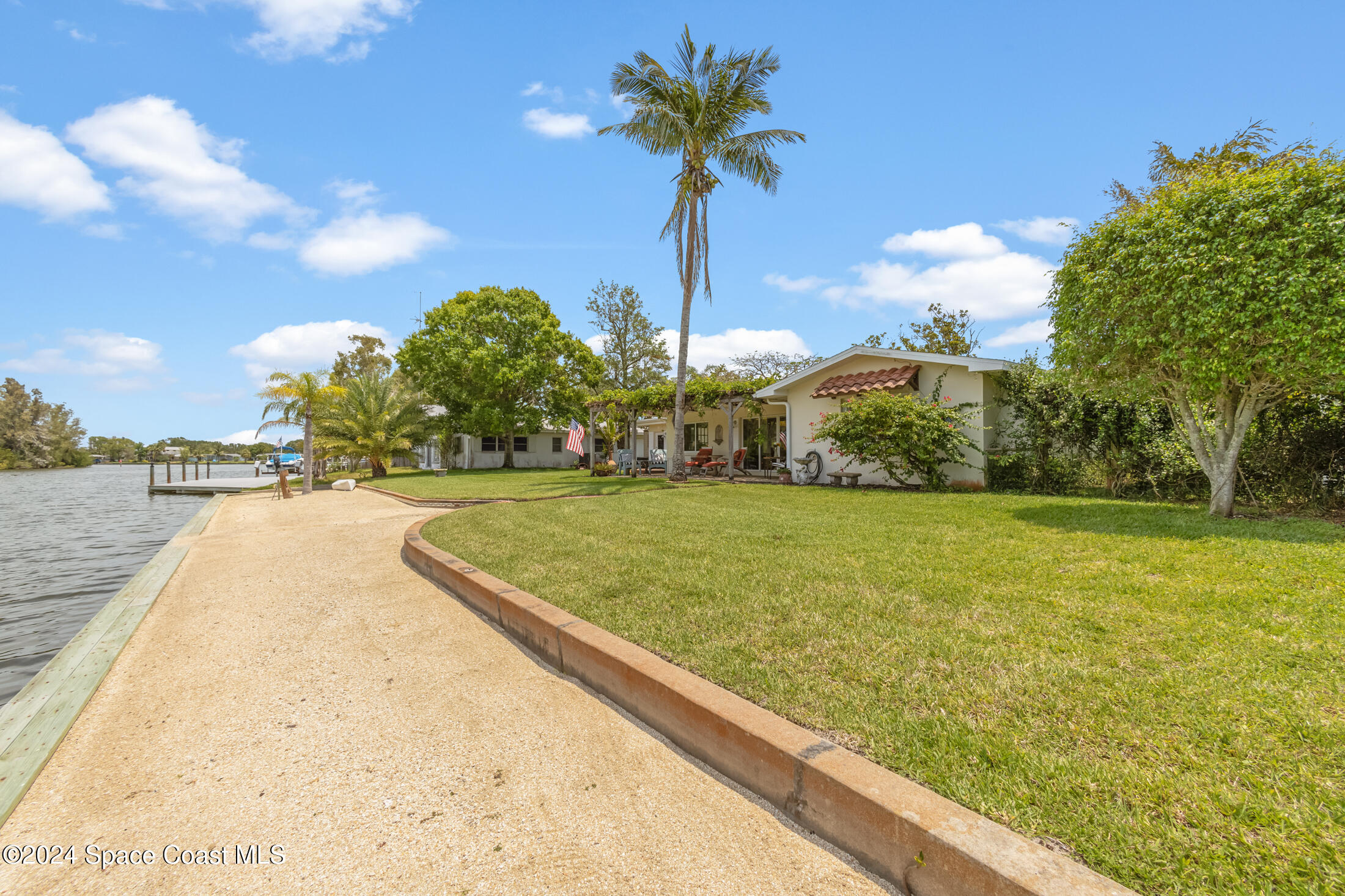 2051 Bali Road Cocoa Beach, FL 32931 - Photo 23 of 33 a view of a garden