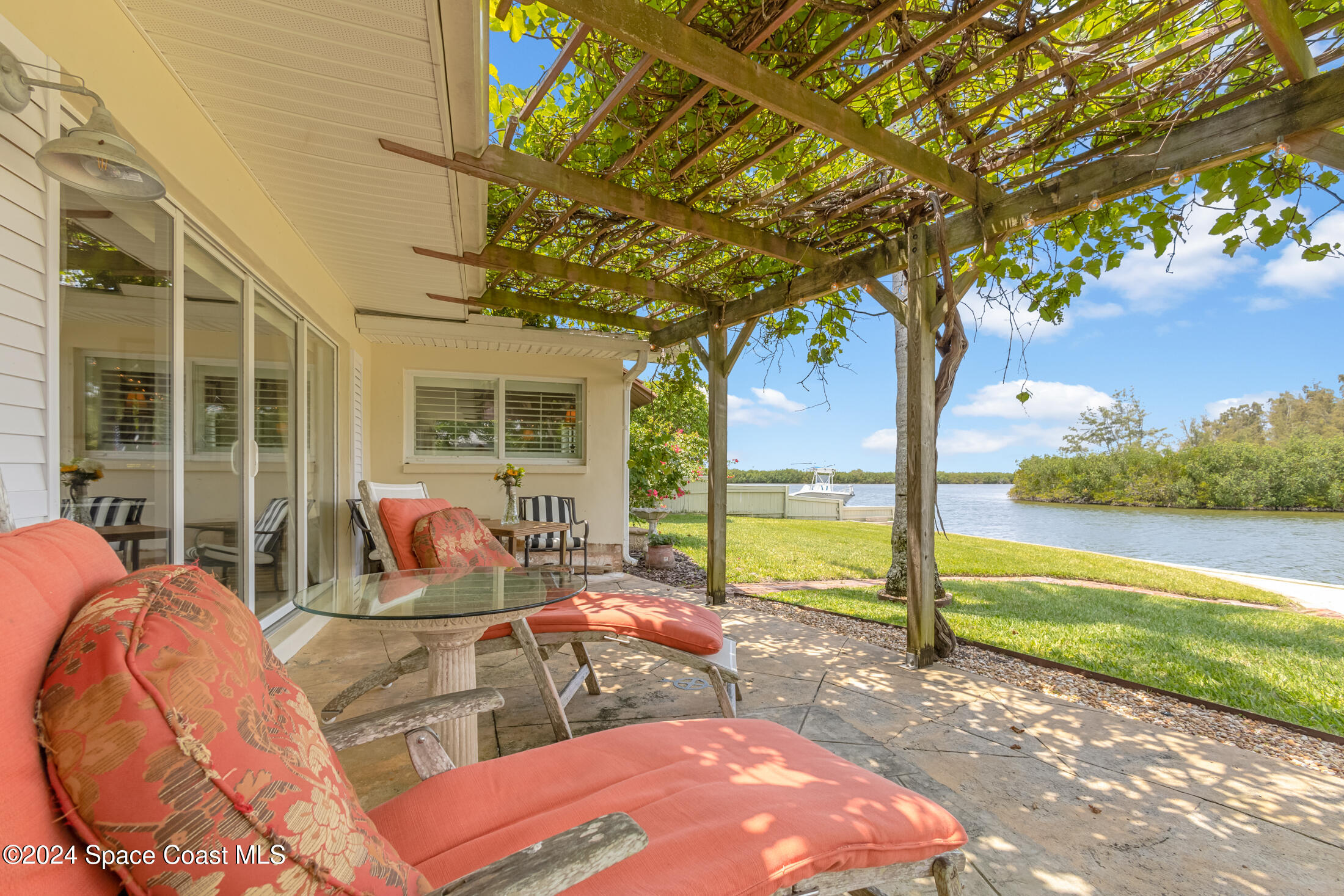 2051 Bali Road Cocoa Beach, FL 32931 - Photo 25 of 33 a view of a swimming pool with a patio