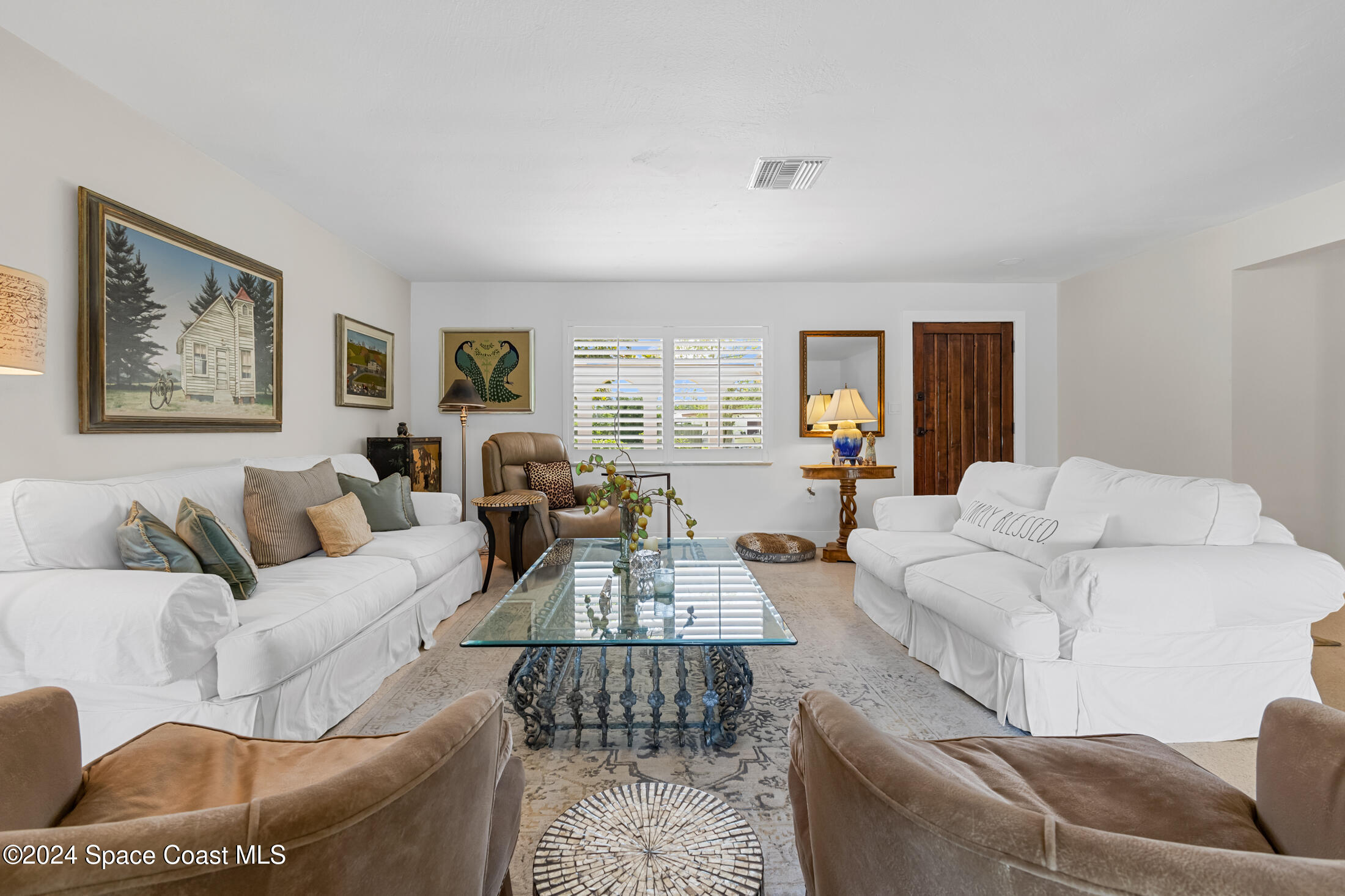 2051 Bali Road Cocoa Beach, FL 32931 - Photo 27 of 33 a living room with furniture or couch and a wooden floor