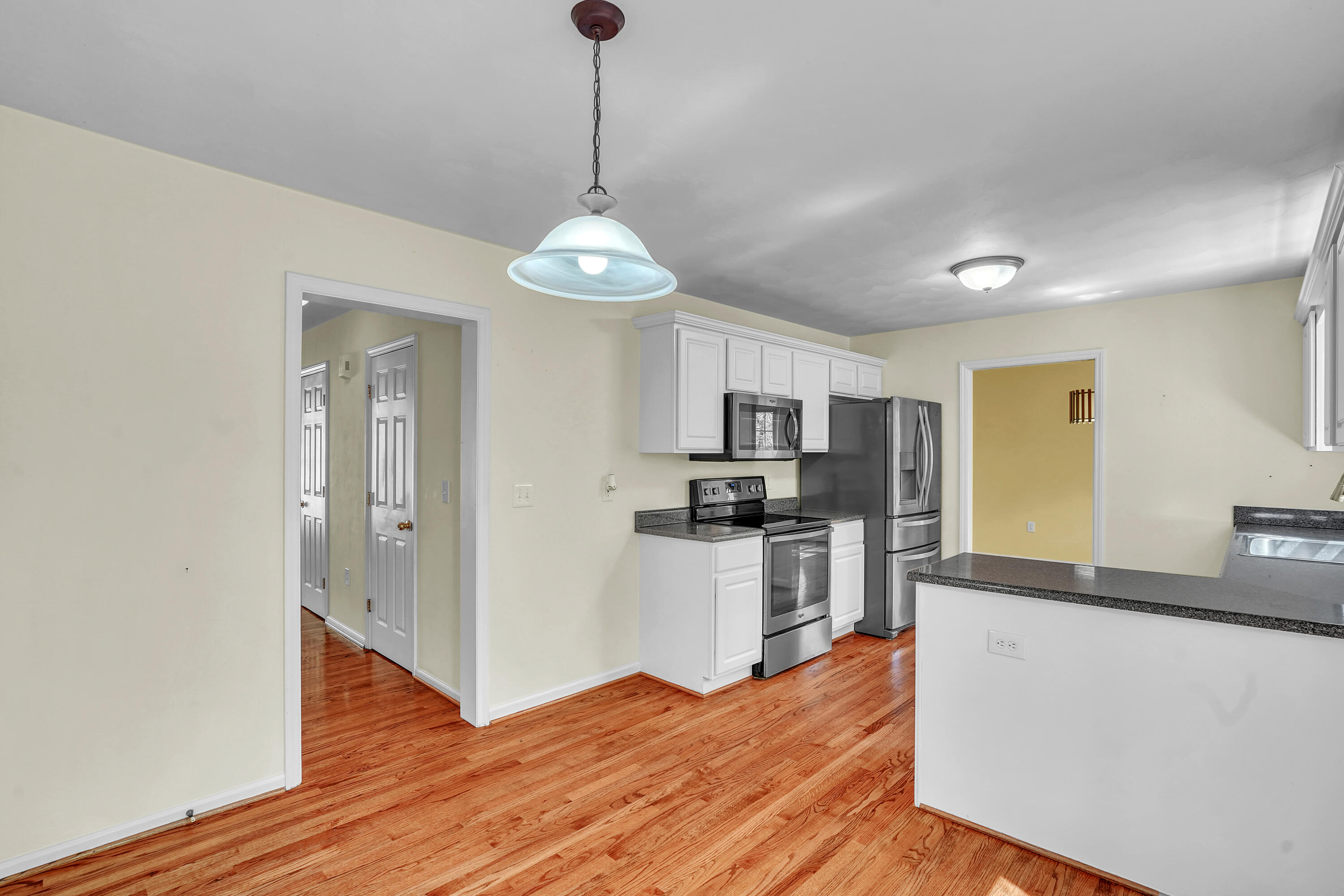 7607 Peebles Lane Roanoke, VA 24018 - Photo 12 of 57 a open kitchen with stainless steel appliances granite countertop a refrigerator and a stove top oven